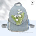 Mochila artesanal de algodão floral com estética florestal para mulheres